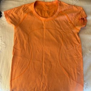 Orange swiftly tech Lululemon short sleeve tshirt. size 6